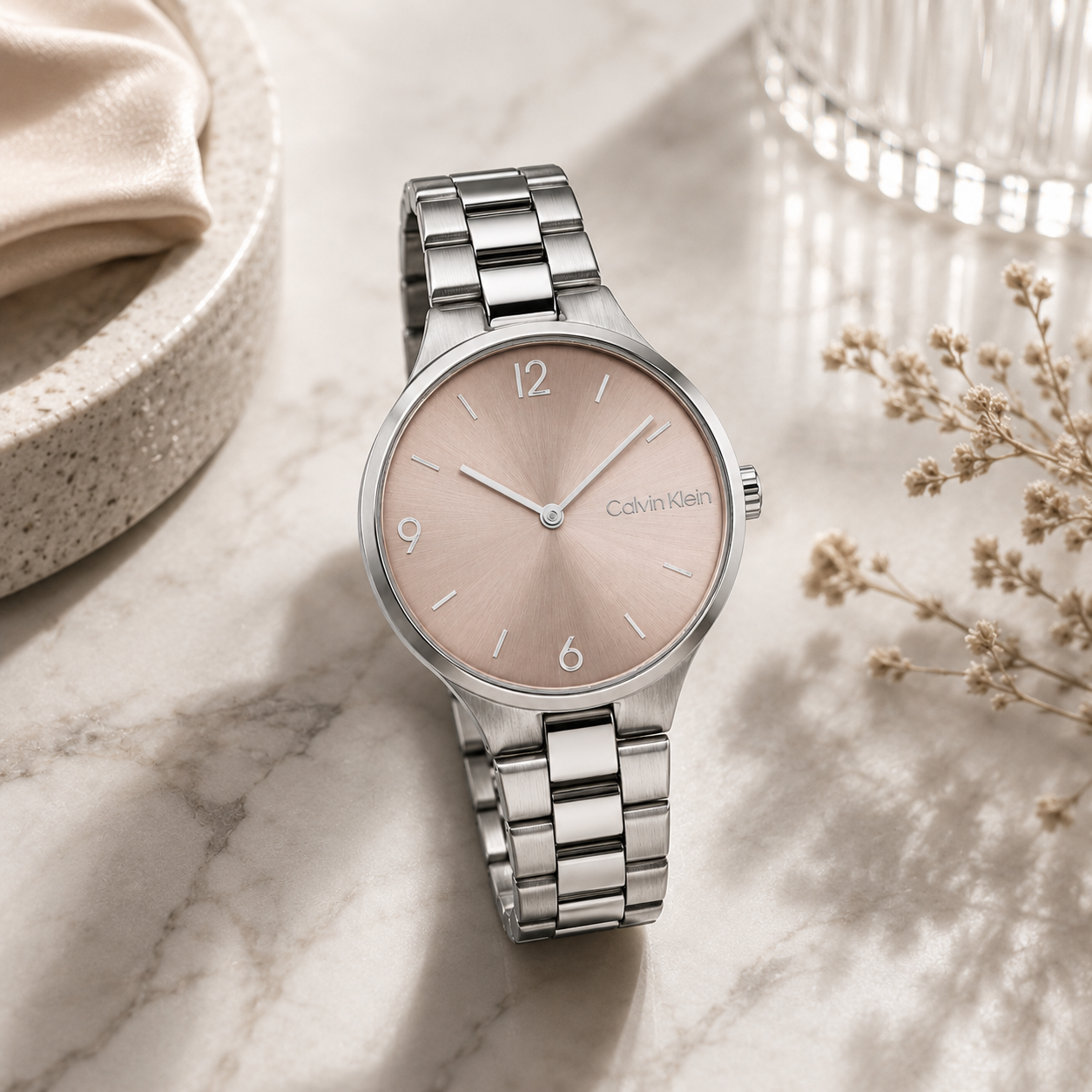 Reloj de mujer Calvin Klein Timeless 25200129 de acero inoxidable plateado con esfera oro rosa satinada e índices numéricos estilizados.