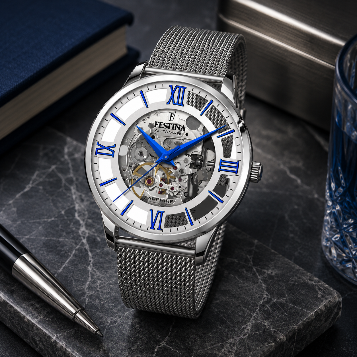 Reloj de hombre automático Festina Skeleton F20534/1 de acero inoxidable con esfera esqueleto, índices romanos azules y correa de malla milanesa.