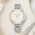  Reloj de mujer Tommy Hilfiger Iris 1782586 bicolor plateado y dorado con esfera blanca grabada con el monograma TH y correa de malla milanesa.
