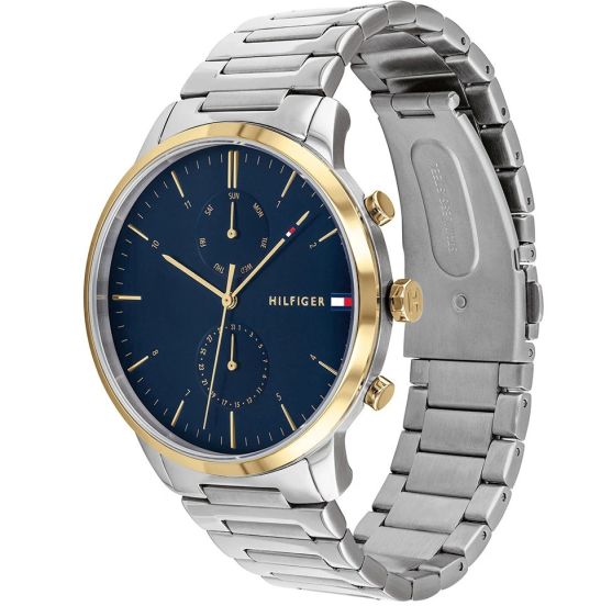 Reloj de hombre Tommy Hilfiger Hunter 1710408 de acero inoxidable plateado con bisel dorado, esfera azul marino y subesferas indicadoras.